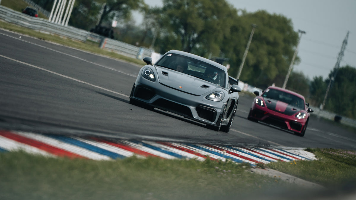 Two Porsche Cayman GT4 RS side by side at the Slovakiaring at a trackday
