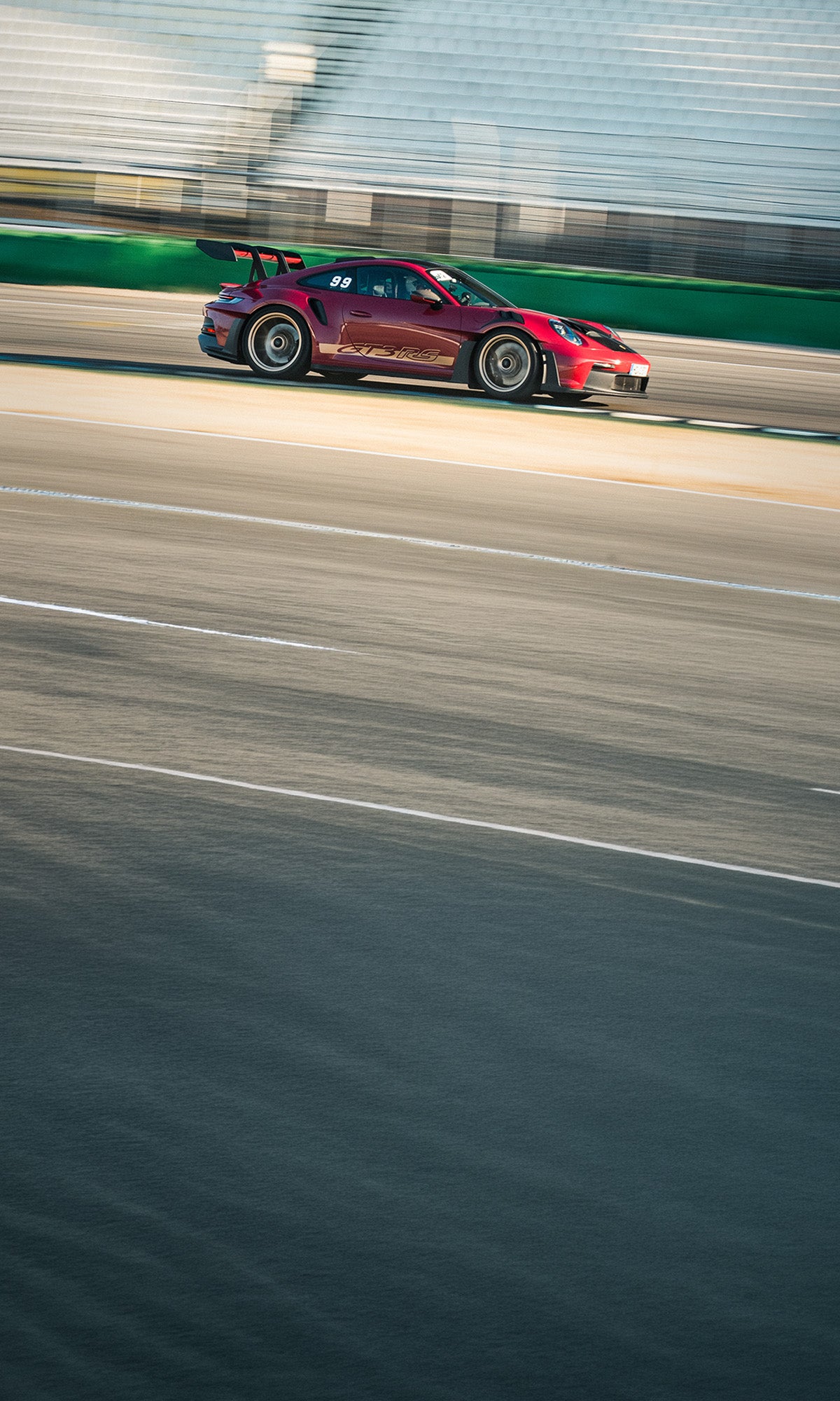 Porsche 911 GT3 RS at the exit of the Sachs corner on the Hockenheimring